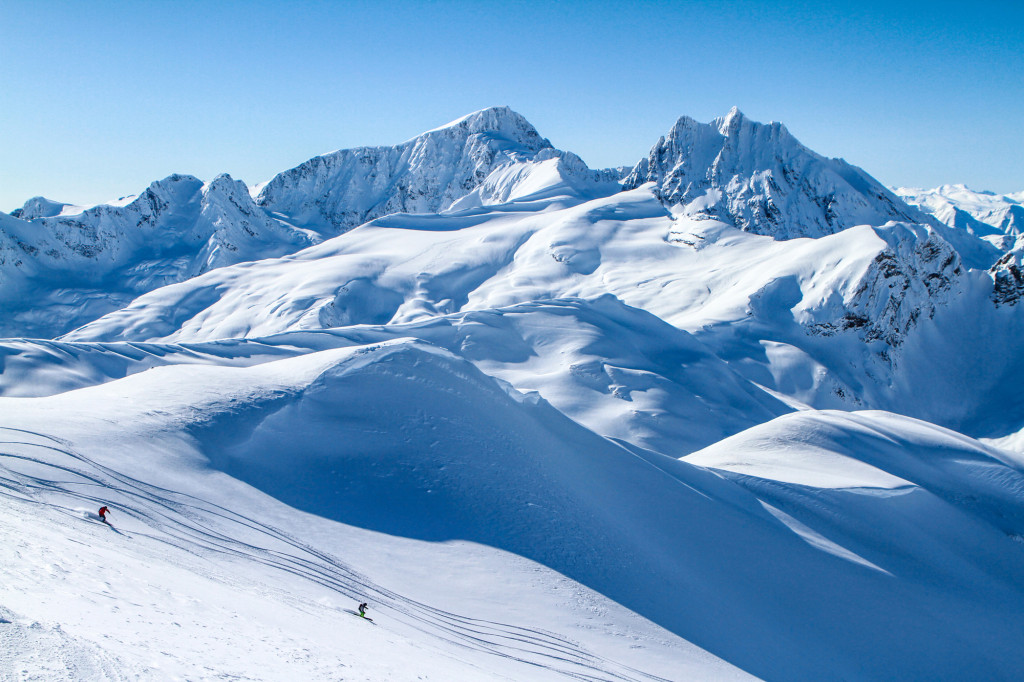 Small Groups Skiing Untracked Snow In The Middle Of Nowhere. What Heliskiing Was Meant To Be.  Photo - Caton Garvie