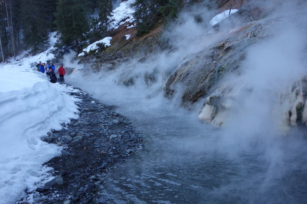 The Hot Water Runs From Small Cracks On The River Bank, When Mixed With The Cool Water Of The Iskut River, It Provides A Perfect Bathing Opportunity | Liam Harrap